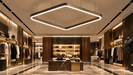Ceiling-mounted rounded-rectangle LED light panel with white glow