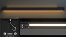Linear LED light fixture with black housing and bright white light strip