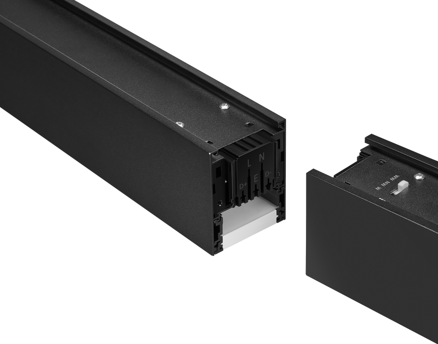 Open black linear LED fixture showing interior channels and electrical connections