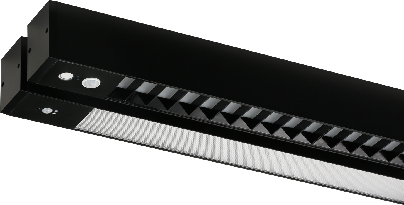 Black channel LED light with vented sides and angled reflector pattern