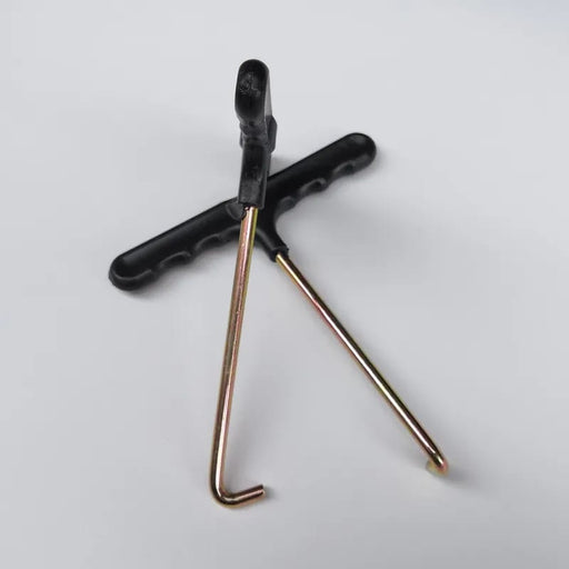 Tile removal tool with black grip, double metal prongs, and long shaft
