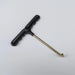 Tile removal tool with black handle and slender metal rod, pointed tip