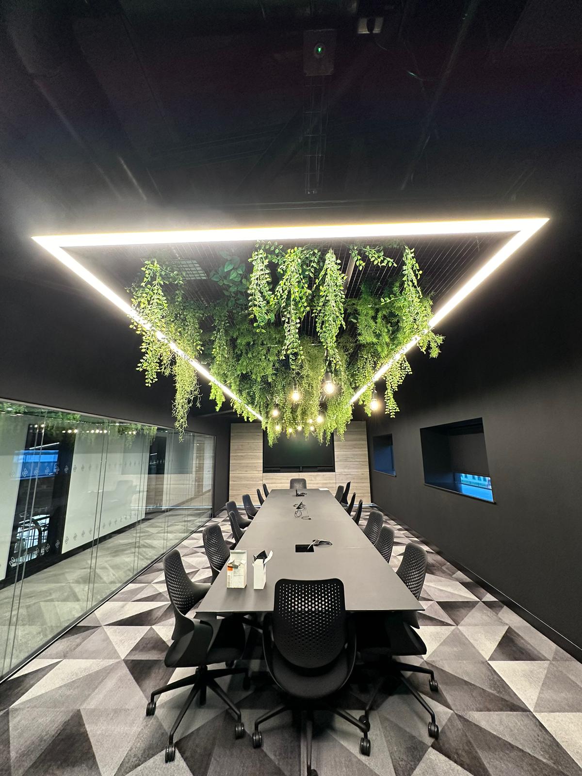 Rectangular illuminated ceiling light with hanging green plant display