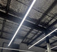 Straight LED linear light bars on ceiling with bright white glow
