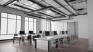 Office meeting room with long conference table and rolling swivel chairs